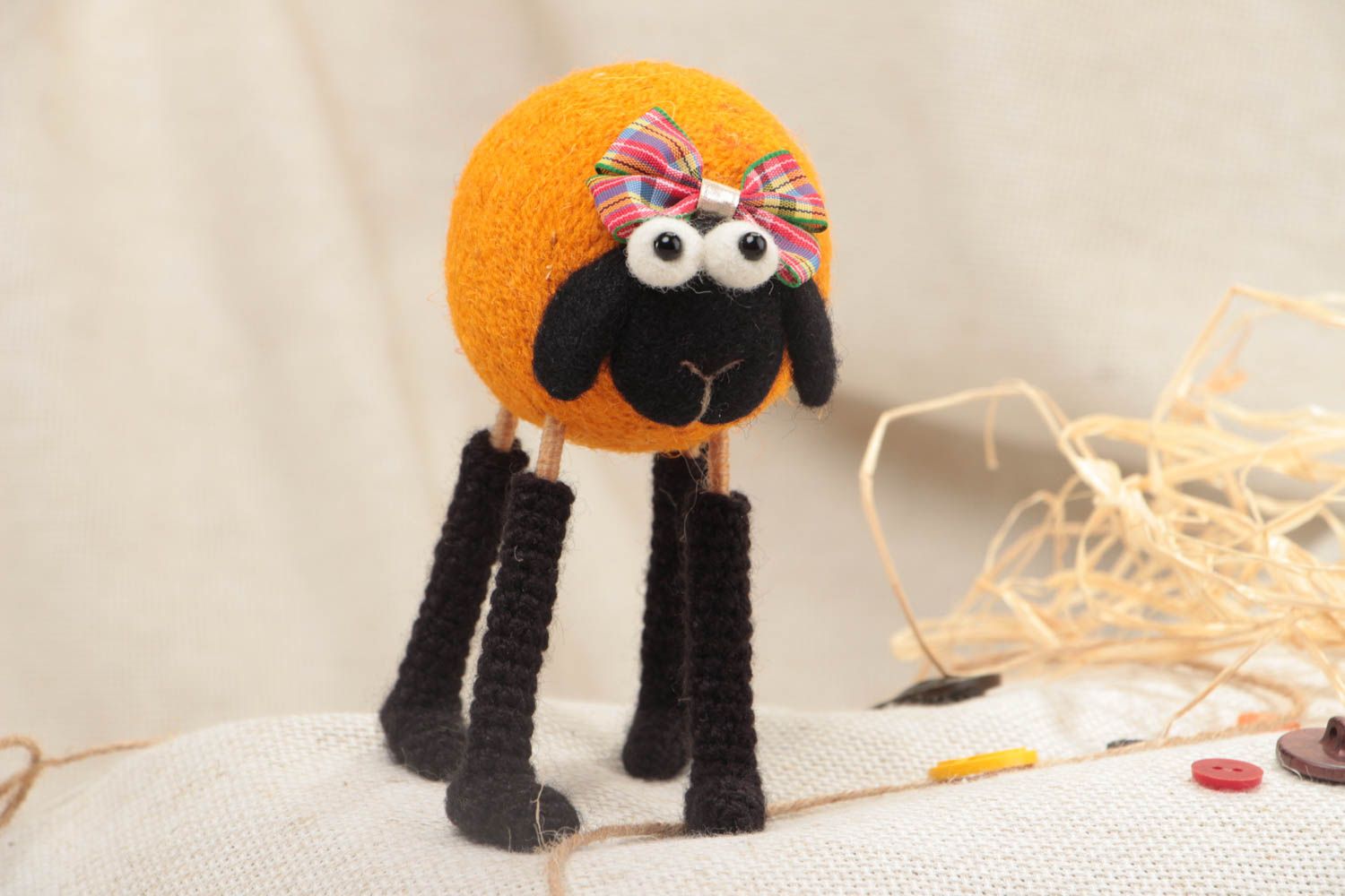 Handmade funny soft toy crocheted and felted of wool orange lamb on wooden paws photo 1