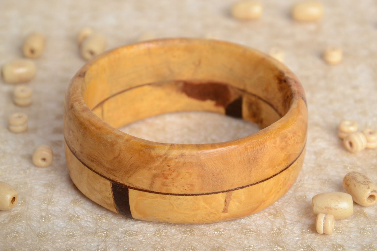 Fashionable handmade wrist bracelet carved of light wood and varnished for women photo 2