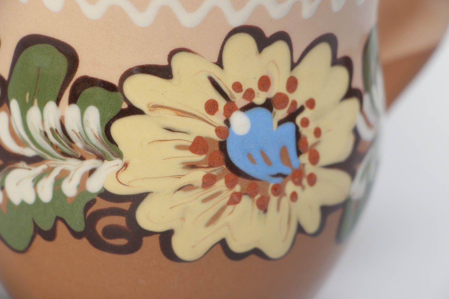 10 oz clay glazed cup with handle and floral design in brown, beige, and blue color photo 3