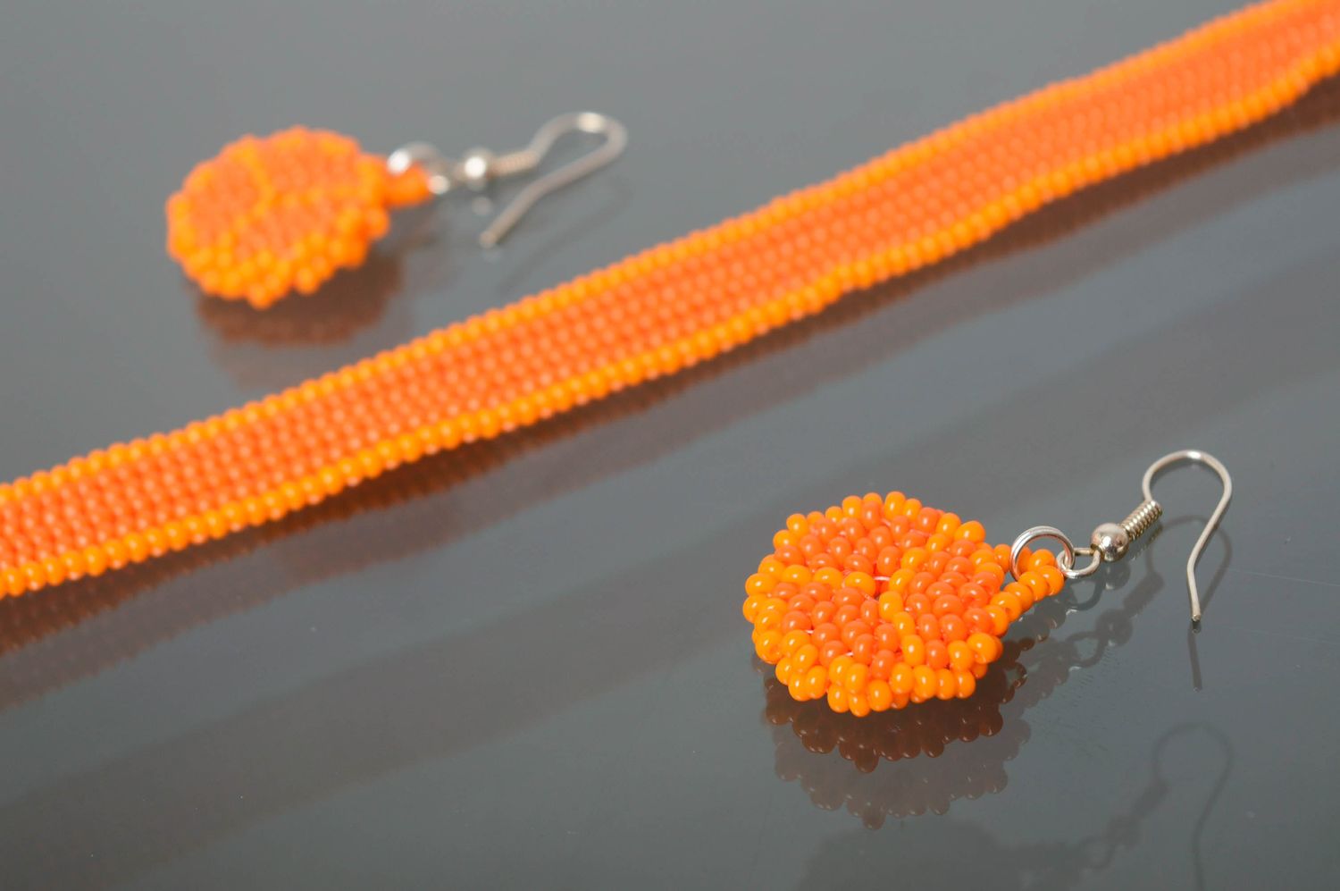 Round beaded earrings of orange color photo 5