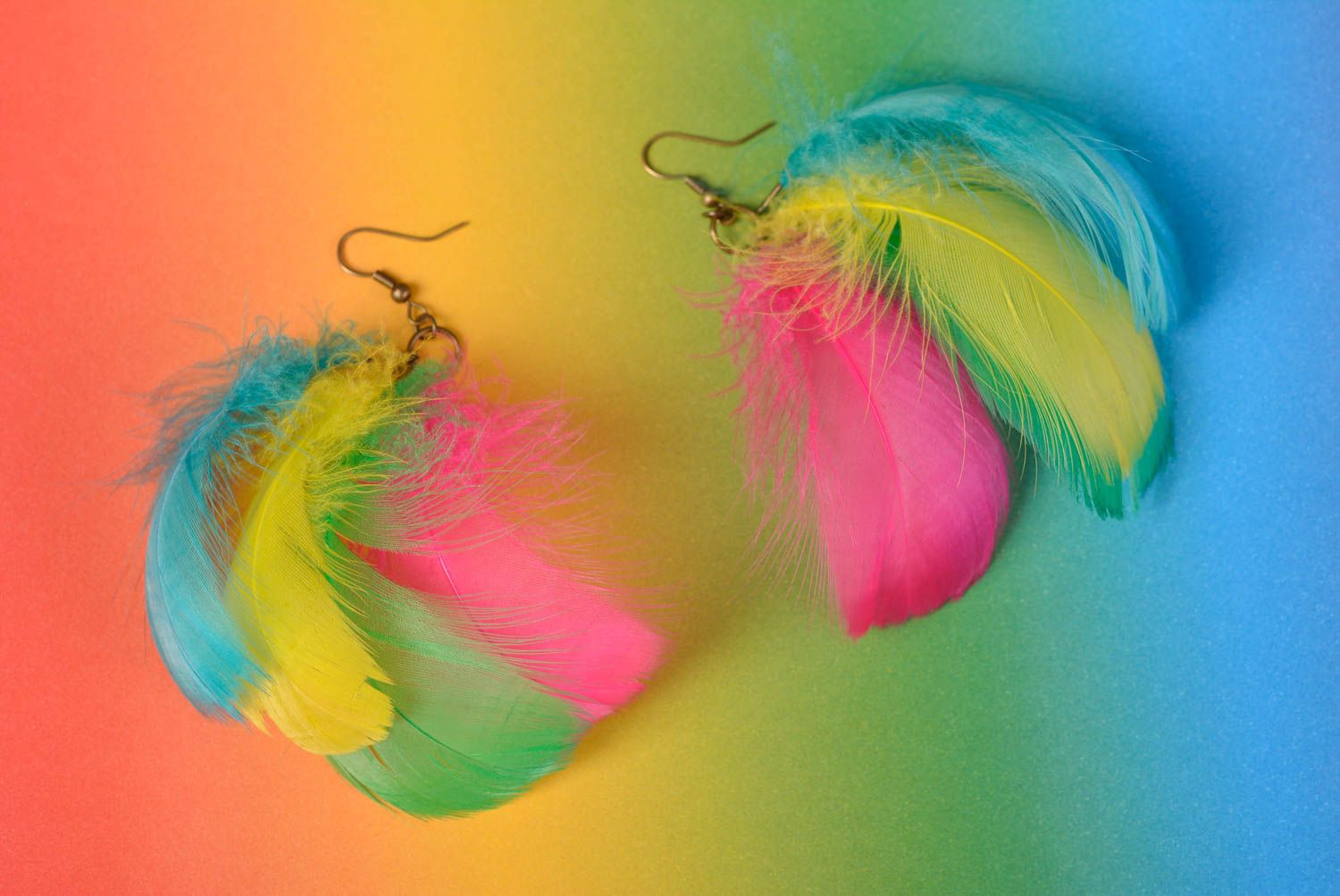 Unusual bright beautiful handmade earrings made of colorful feathers photo 1