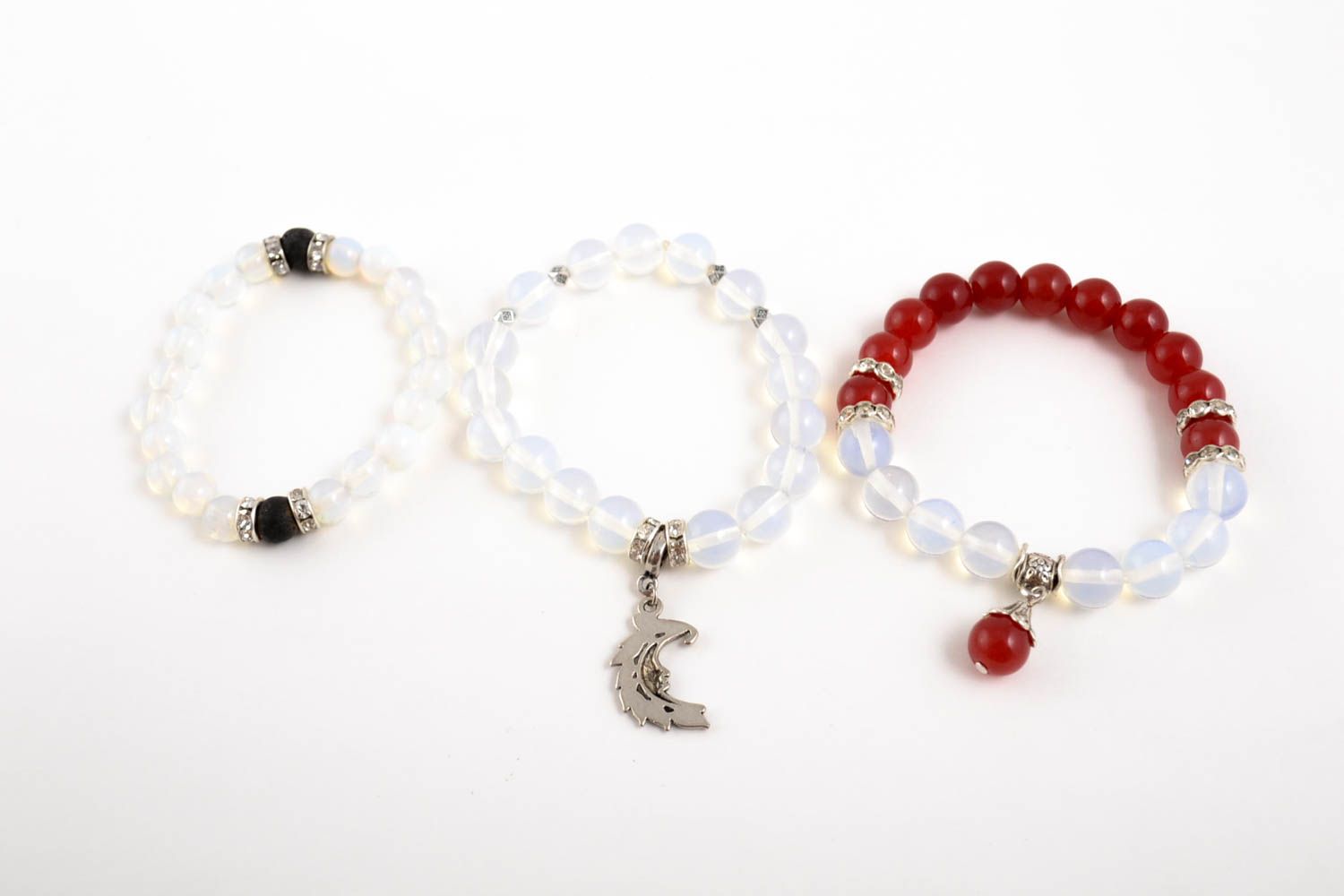 Set of three transparent beaded gemstone bracelets with charms for girls photo 1