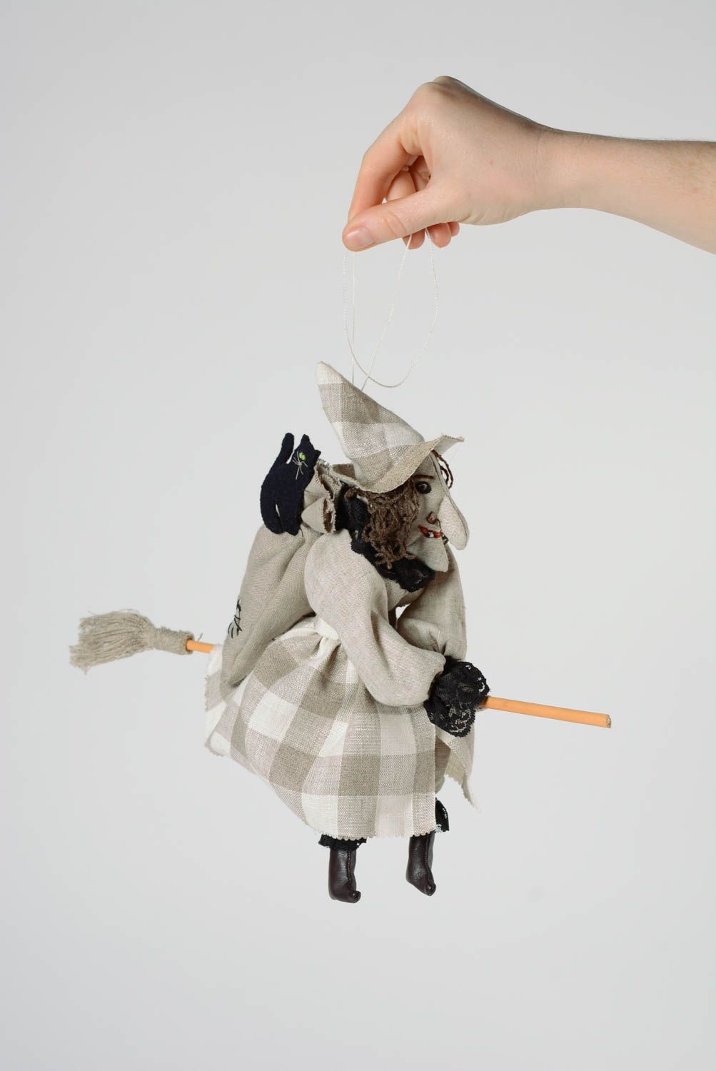 Handmade interior soft toy sewn of linen fabric Witch on a broom with eyelet photo 5