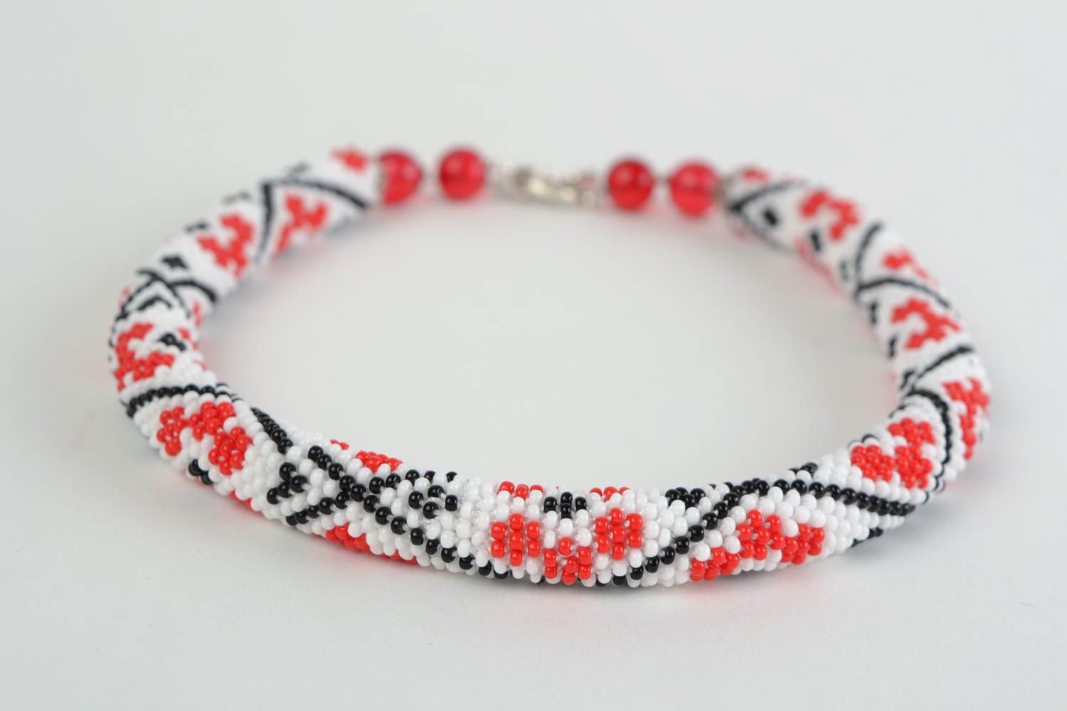 Handmade beaded cord necklace handmade with red flowers on white backgroun photo 4
