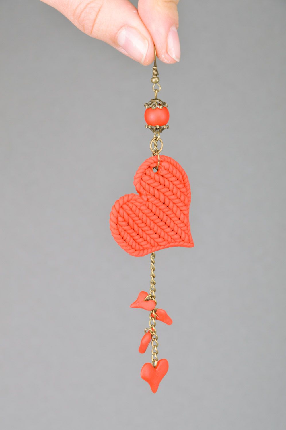 Long handmade earrings with red heart charms and with  knitted texture photo 3
