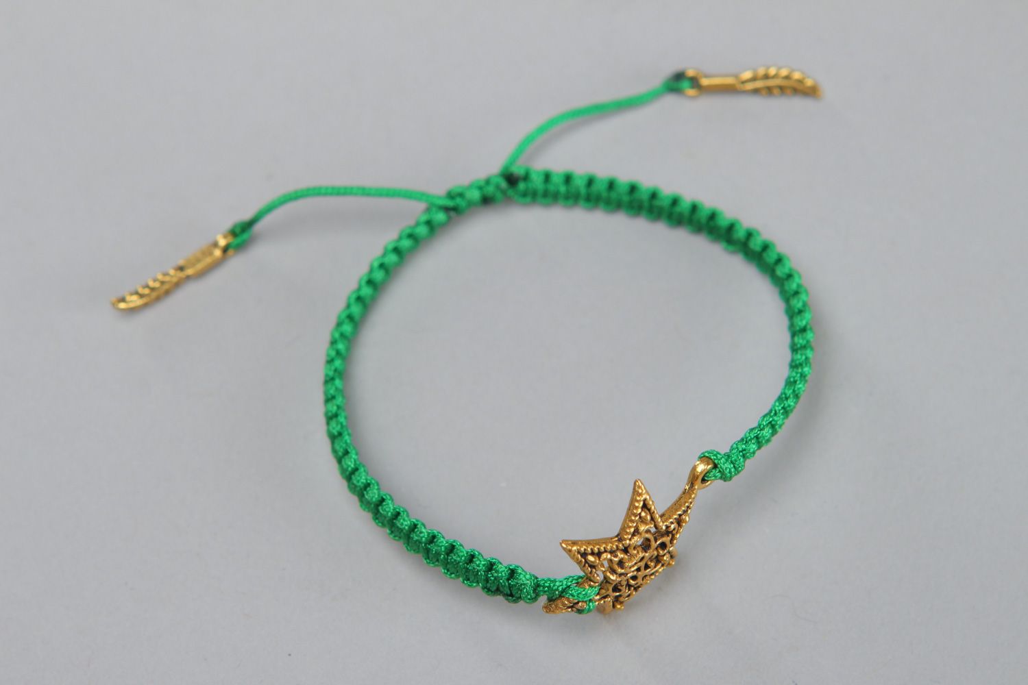 Handmade friendship bracelet woven of green cord with metal star for girls photo 2