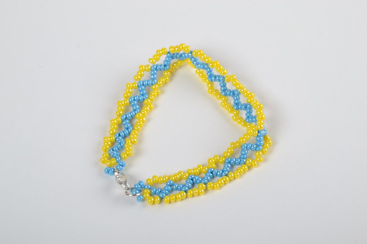 Beautiful bright handmade volume woven bead bracelet of yellow and blue colors photo 2