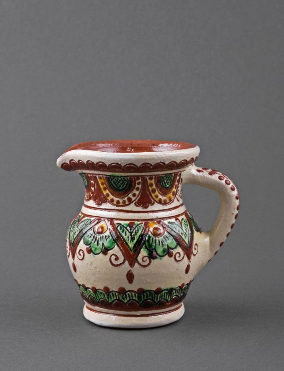 Decorative clay pitcher photo 2
