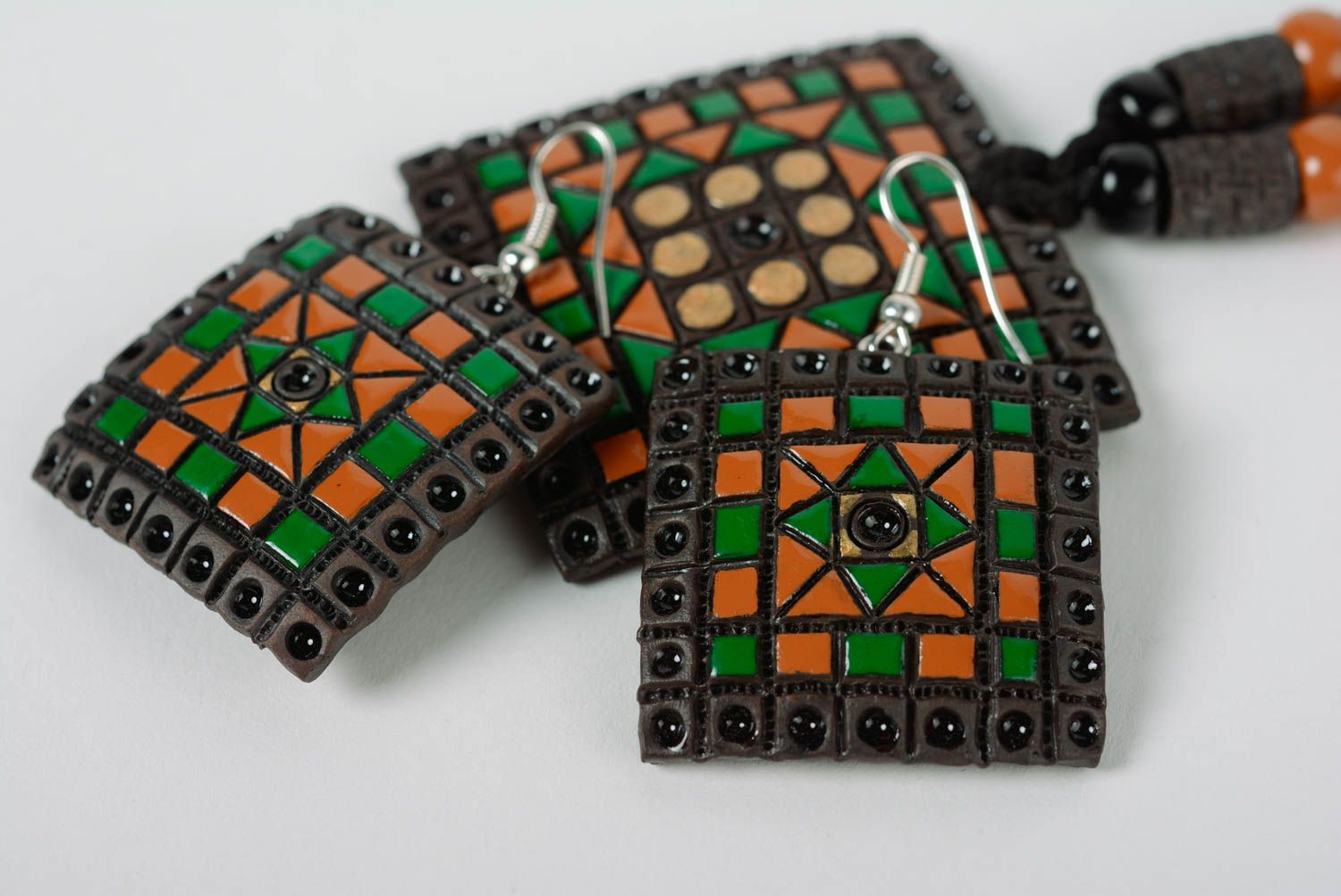 A set of handcrafted ceramic earrings and necklace made of clay with colored enamel paintings photo 2