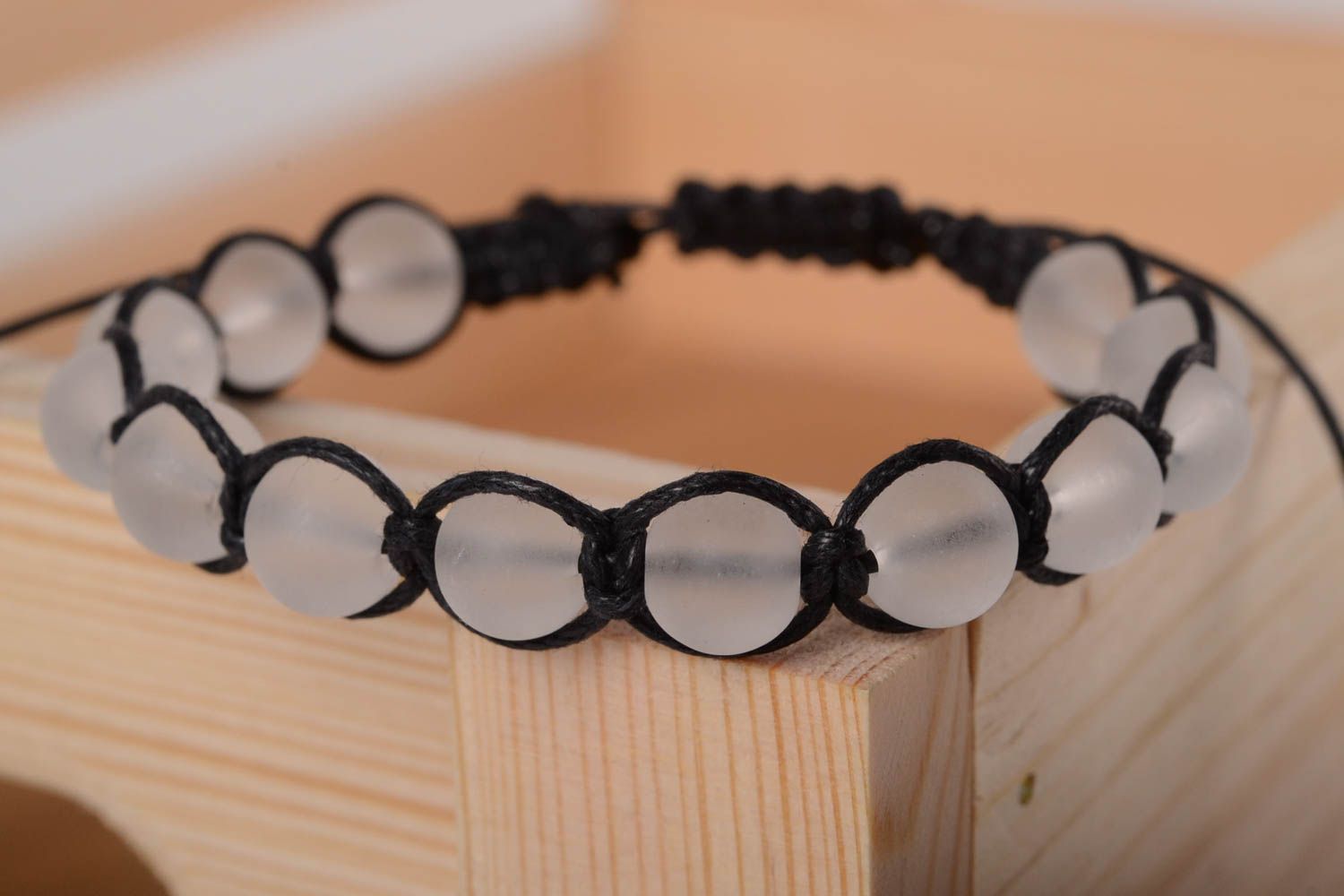 Transparent beads strand bracelet with black cord photo 1