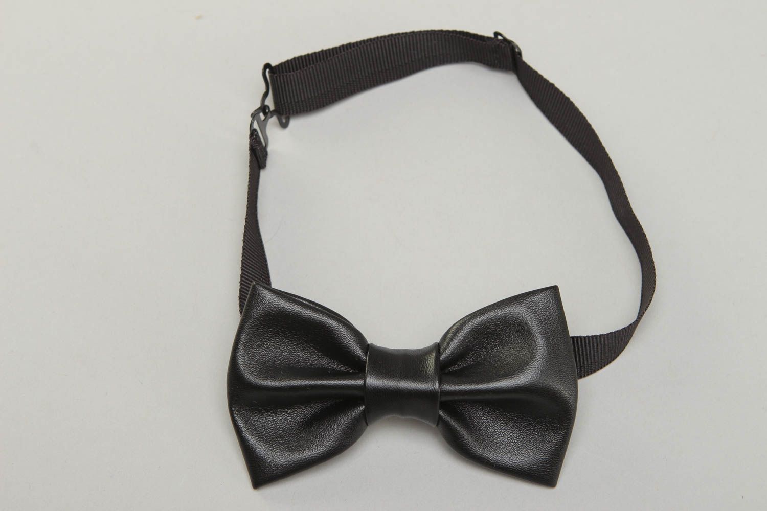 Black bow tie made of leather fabric photo 1