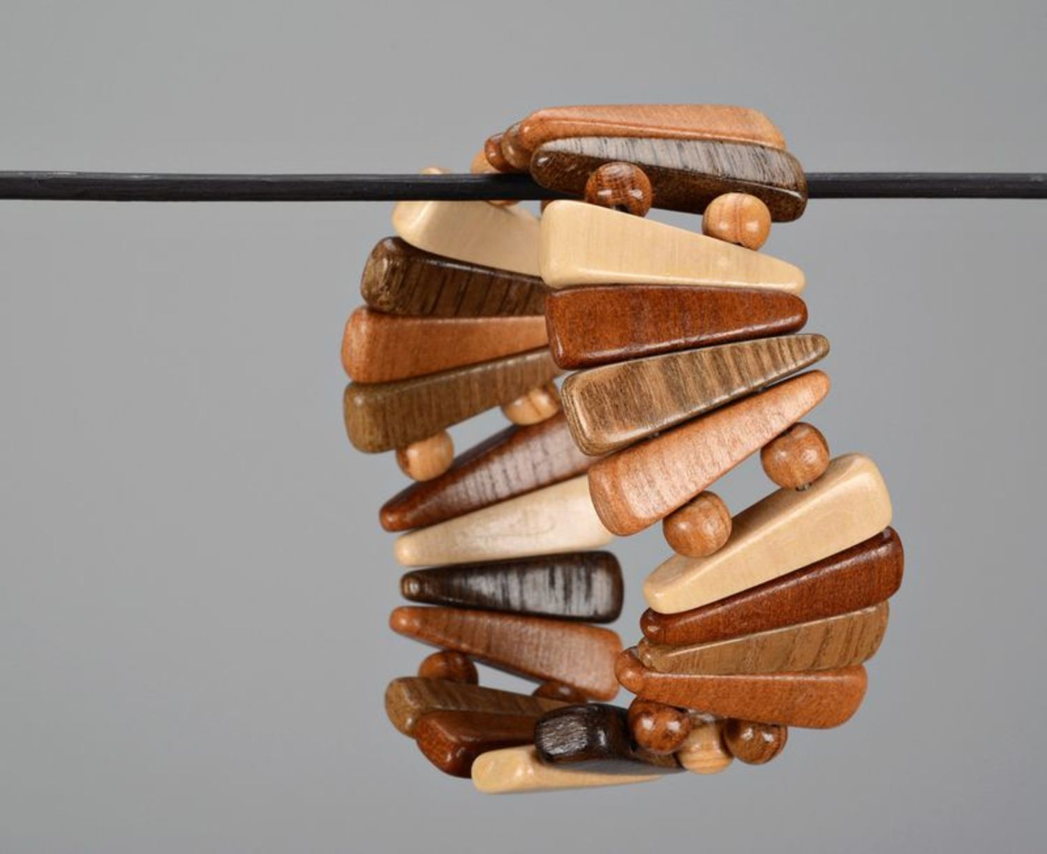 Fashionable wooden bracelet of brown color photo 4