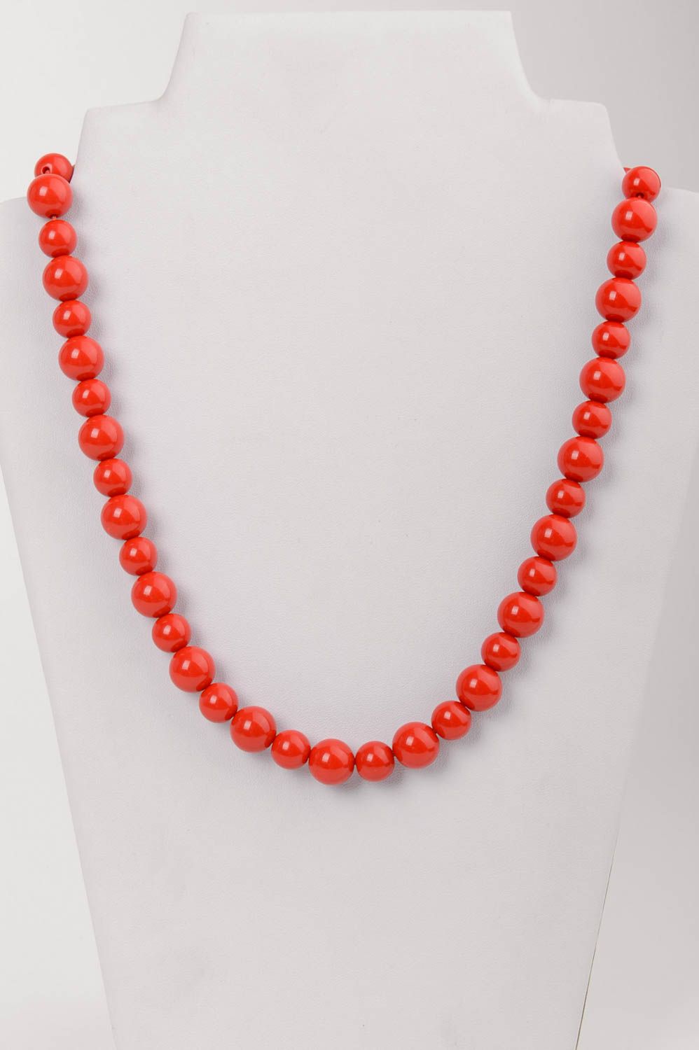 Handmade simple red necklace made of plastic beads with clasp photo 1