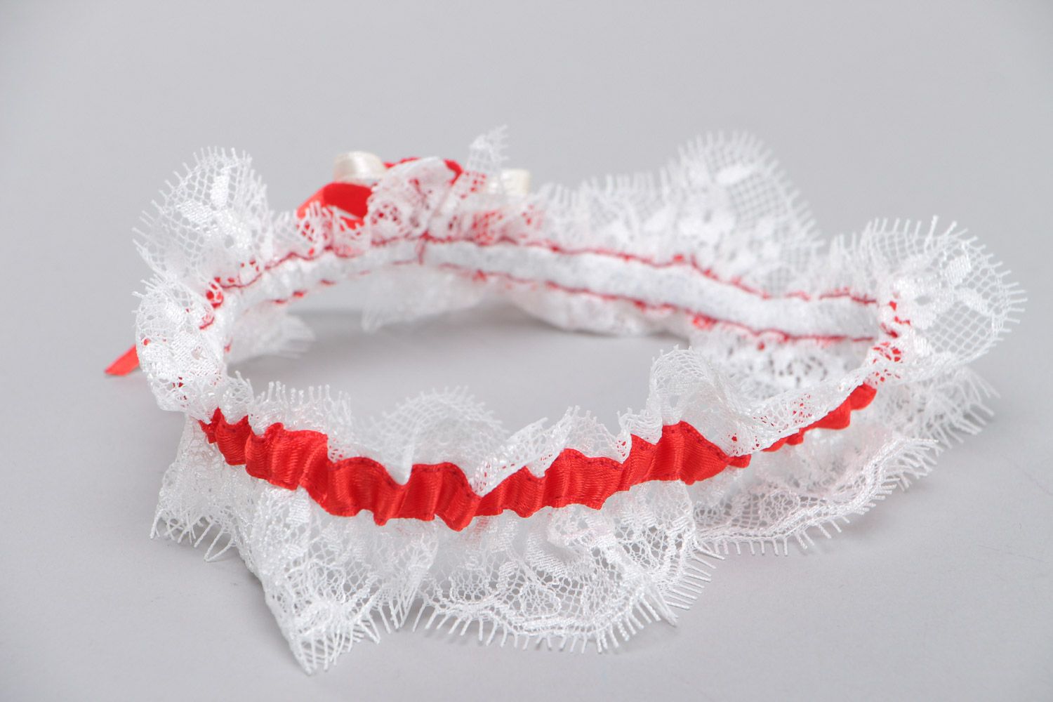 Handmade white wedding bridal garter with French lace and red satin ribbon photo 4