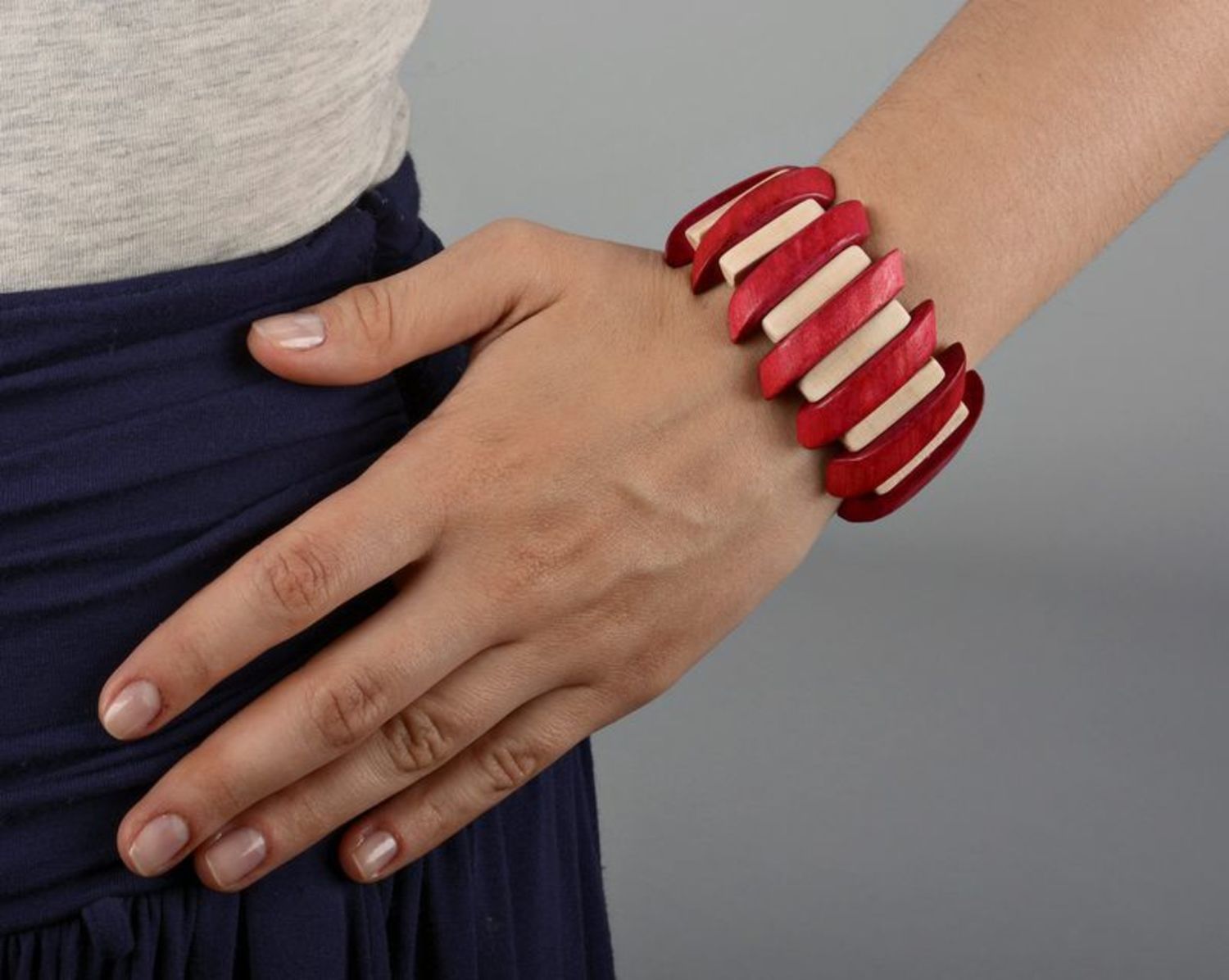Wrist bracelet of red and white colors on elastic band photo 5