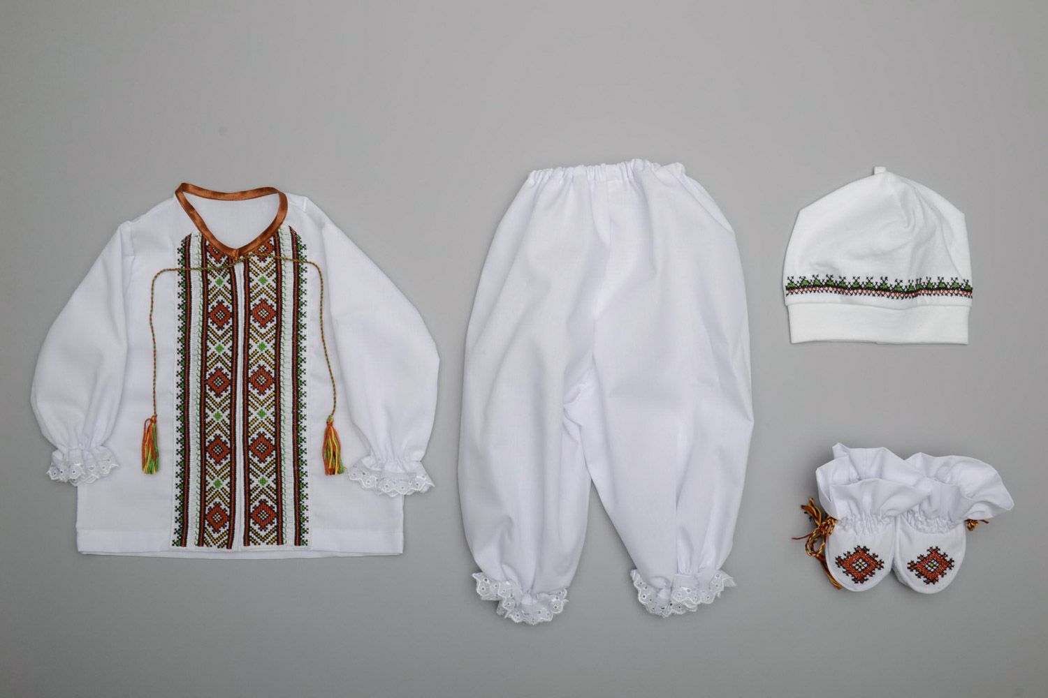 Set of handmade baby boy clothes shoes hat shirt and trousers in Ukrainian style photo 4