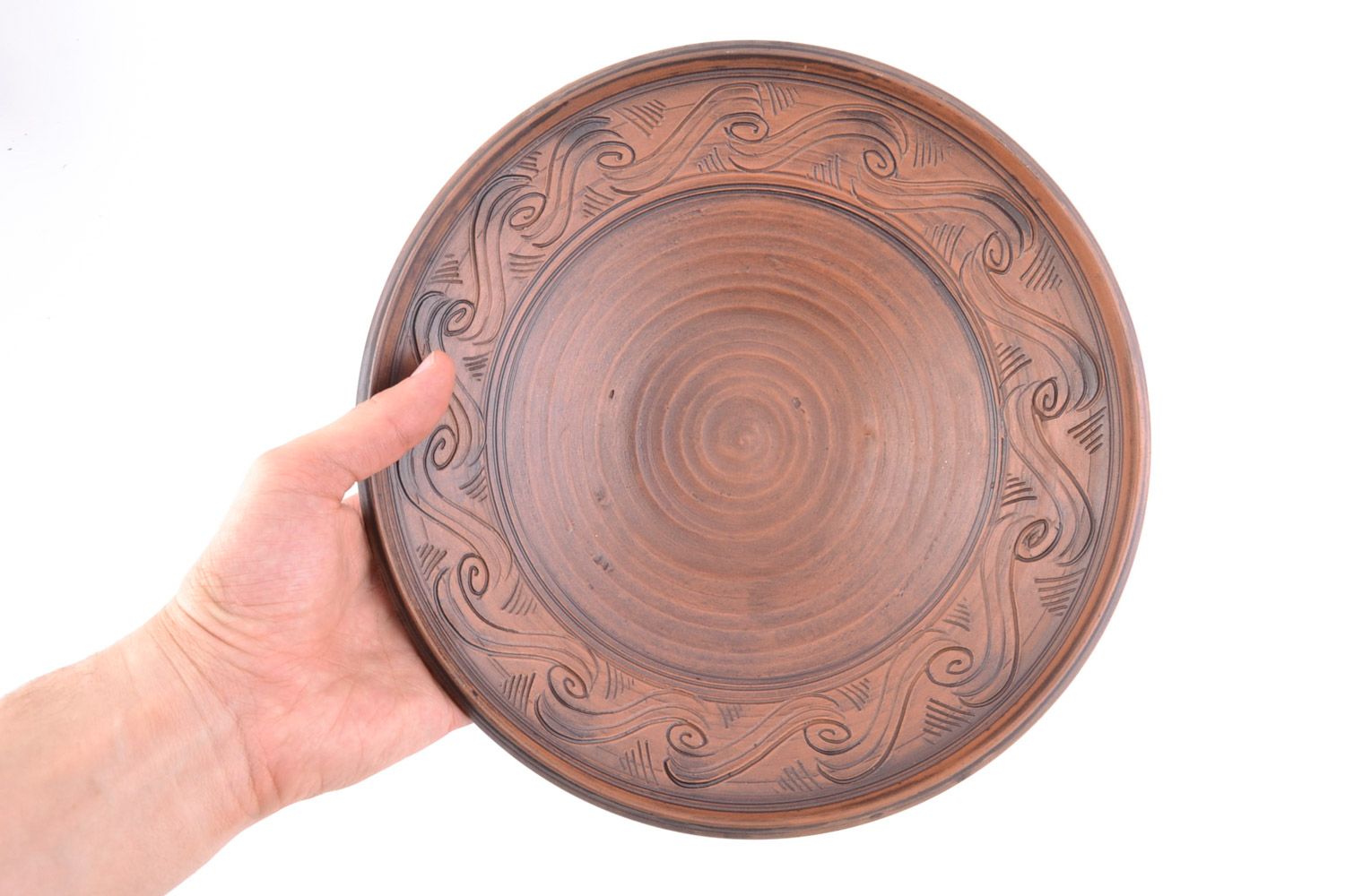 Handmade large ornamented red clay plate of brown color kilned with milk photo 2