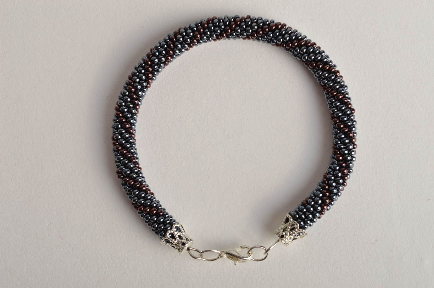 Handmade beaded cord bracelet in silver and dark cherry color photo 3