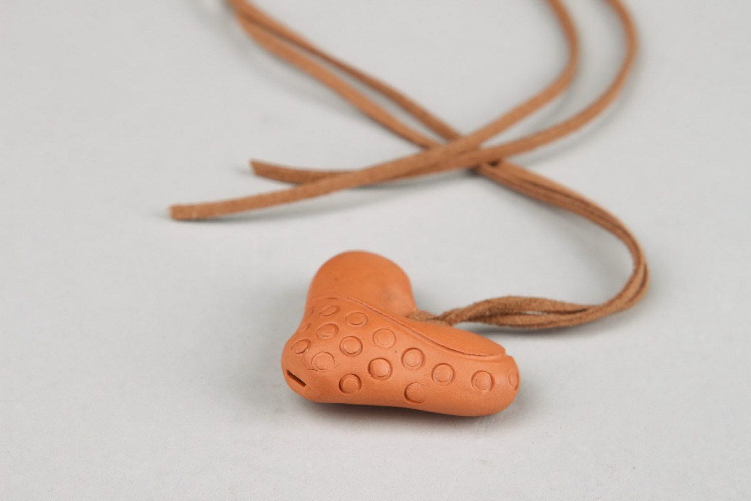 Heart-shaped tin whistle pendant made of clay  photo 3