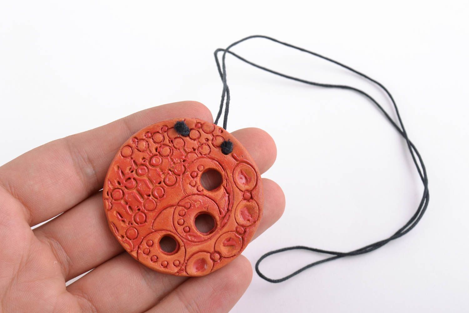 Handmade clay pendant round orange accessory with ornament on long cord photo 2
