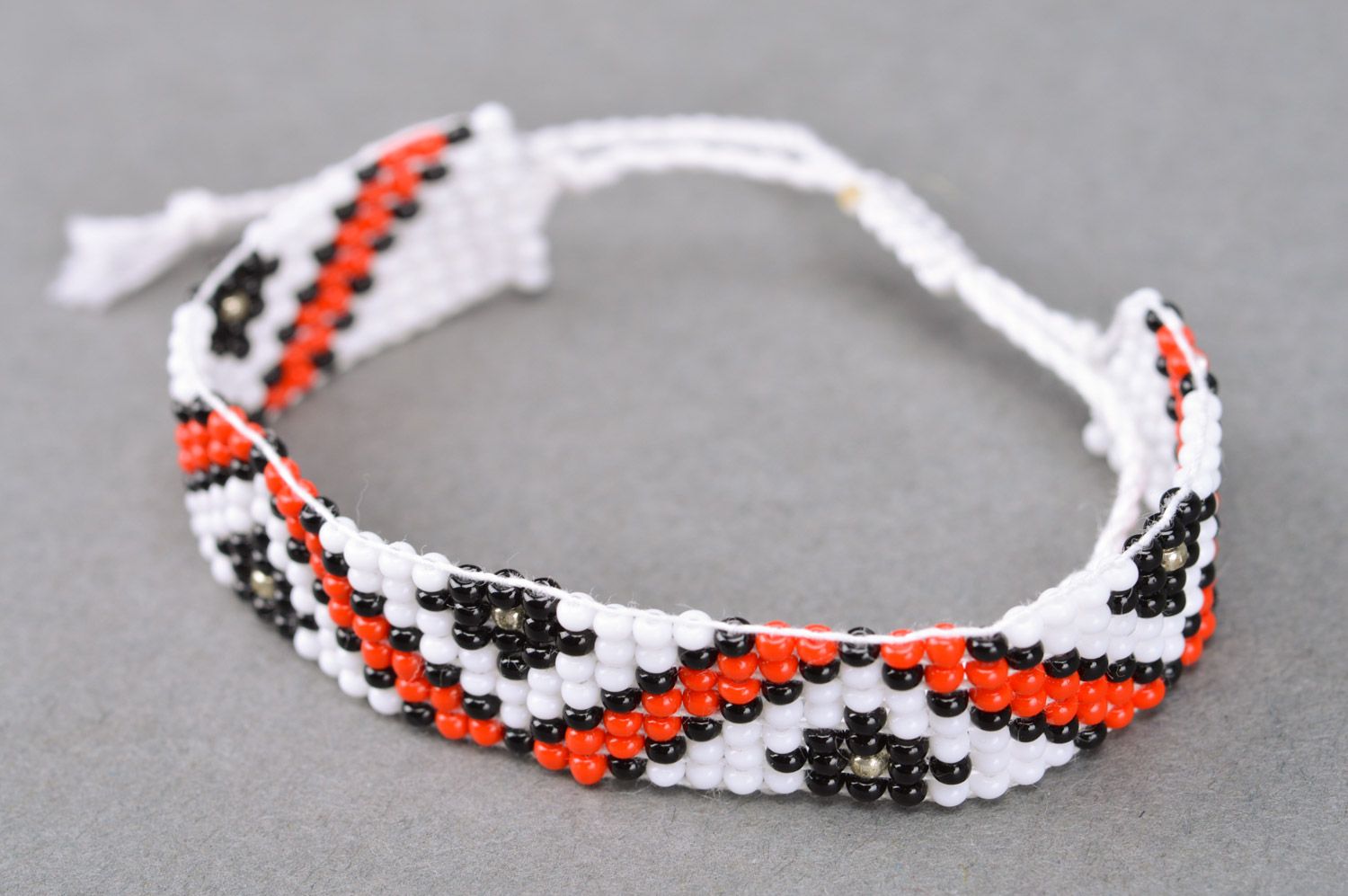 Handmade wide beaded bracelet with beautiful patterns and ties photo 2