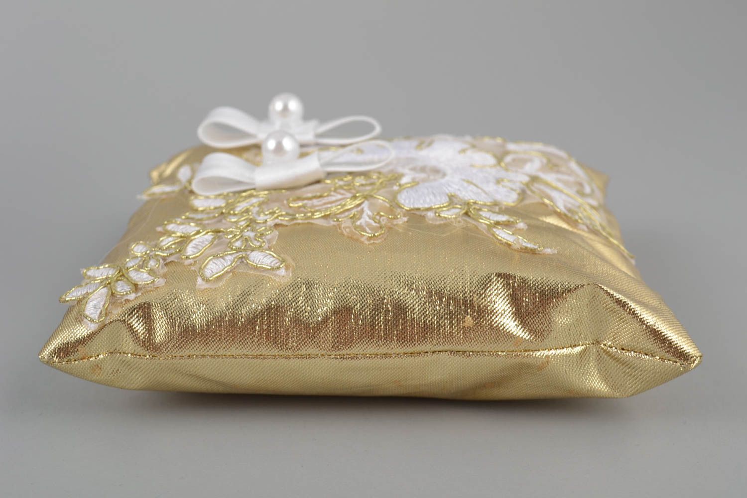 Handmade decorative golden fabric wedding ring pillow with beads and bows photo 5