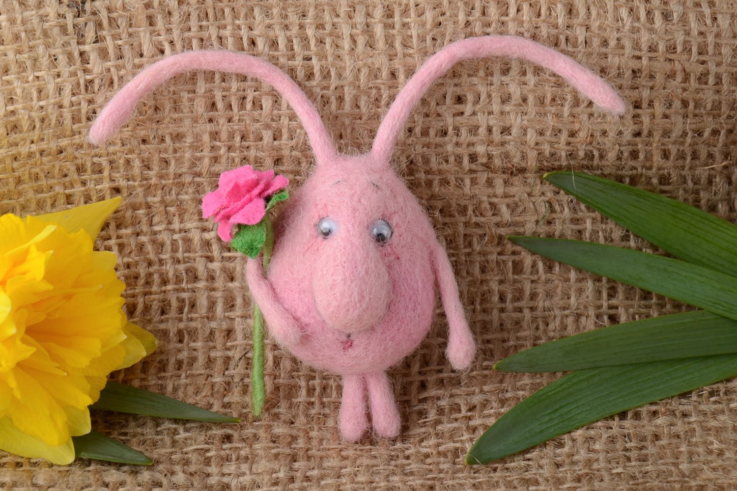 Handmade fridge magnet felted of natural wool touching pink creature with flower photo 1