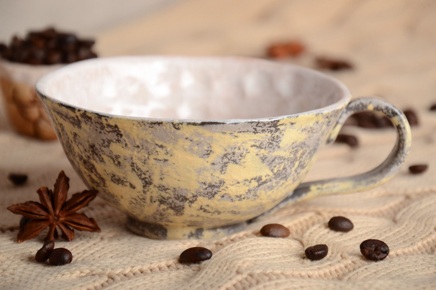 Glazed ceramic cup in beige and brown color with the handle photo 1