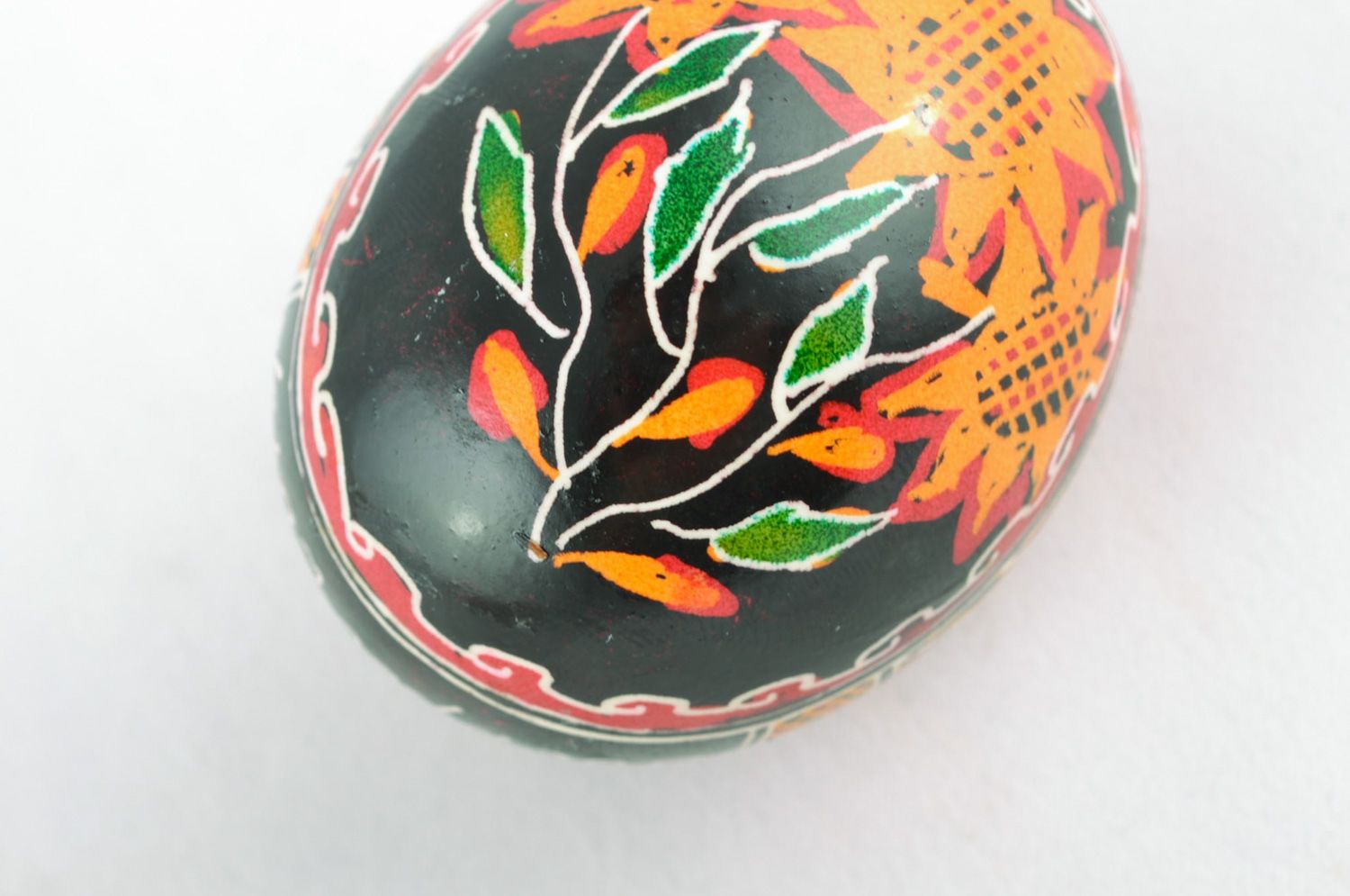 Handmade Easter egg with floral ornament on black background painted with hot wax photo 5