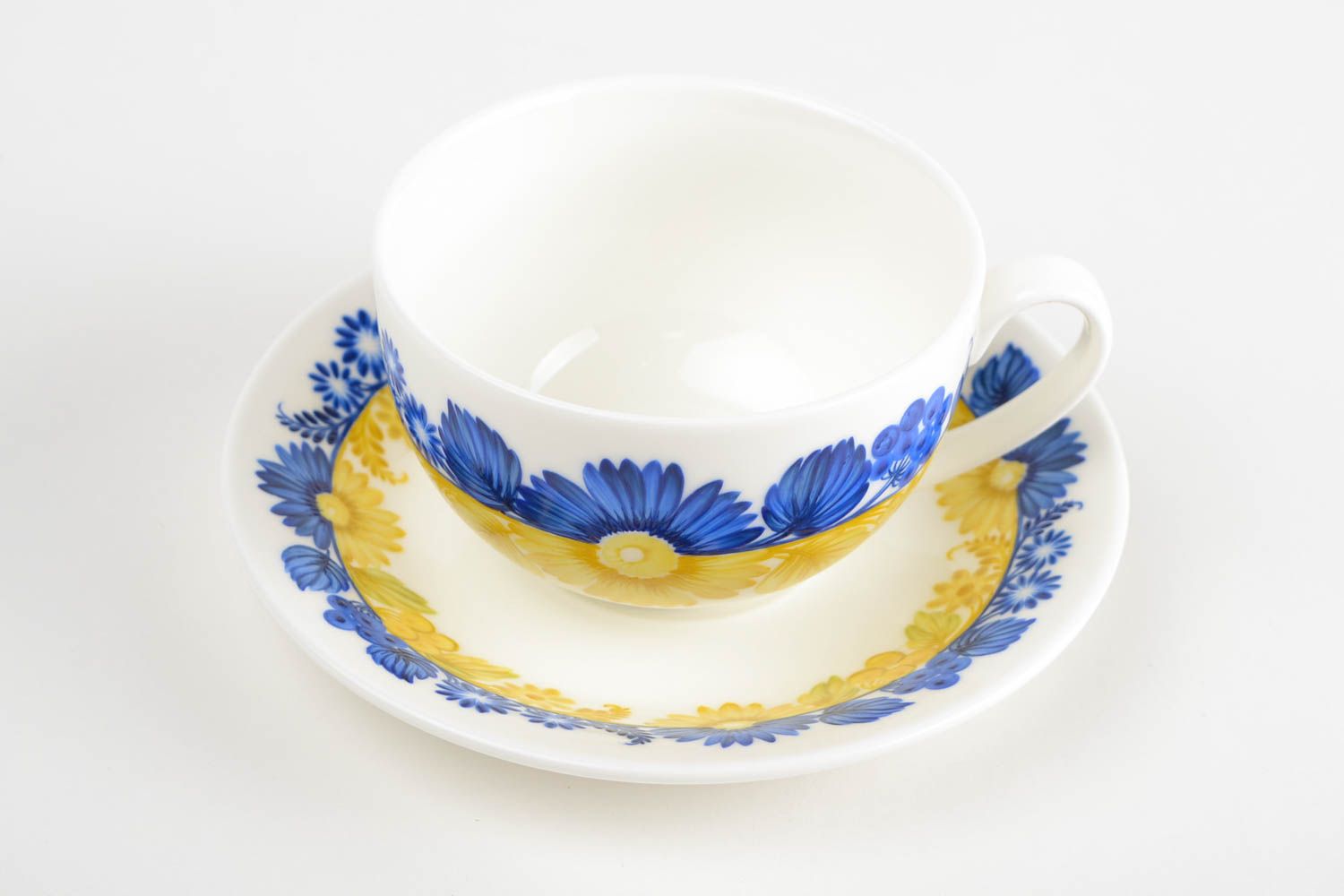 Porcelain yellow, white, and blue colors teacup in floral design with handle and saucer photo 5