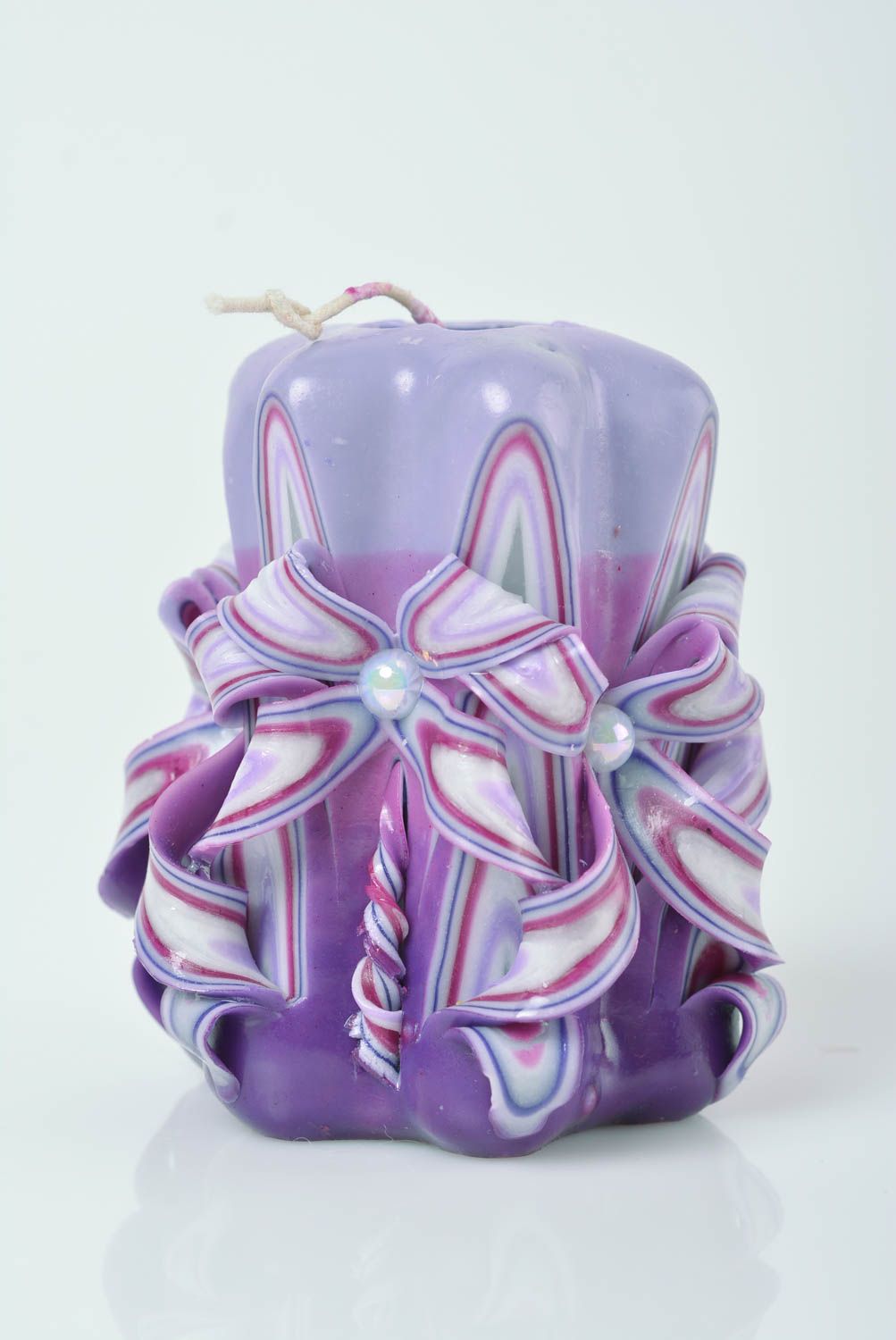 Beautiful homemade designer carved paraffin candle of lilac color with beads photo 1