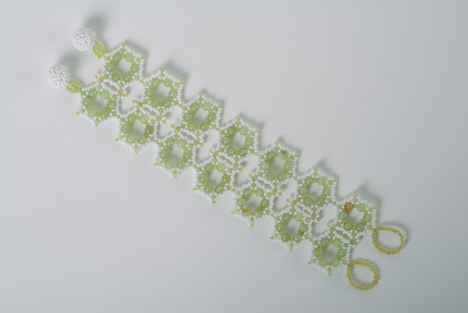 Tender wide handmade lacy wrist bracelet woven of white and light green beads photo 5
