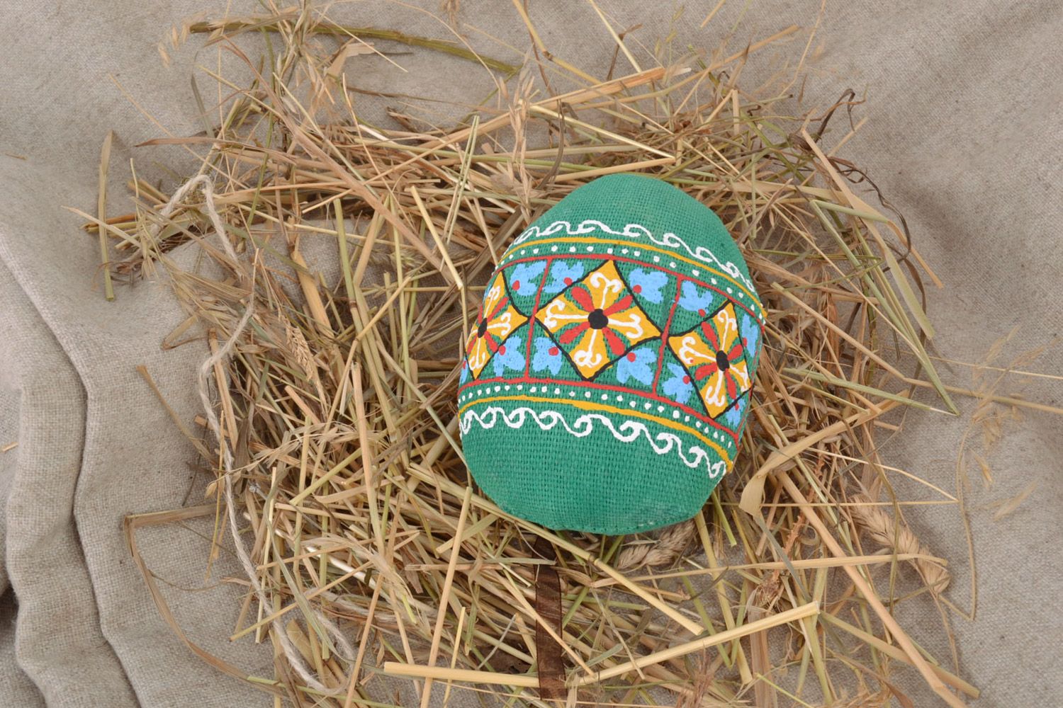 Handmade decorative wall hanging Easter egg sewn of fabric in green colors photo 1