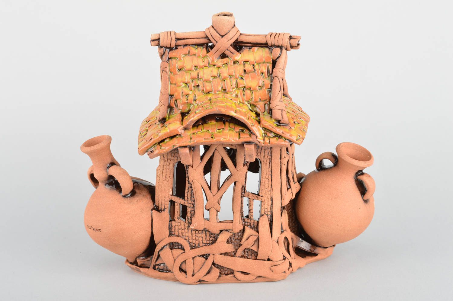 Candelero artesanal de cerámica decorativo con forma de casa hecho a mano foto 5
