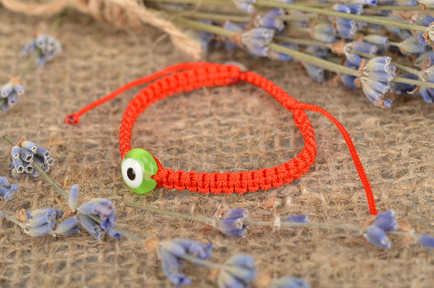 Плетеный детский браслет на руку ручной работы из вощеной нити Зеленый глаз фото 1
