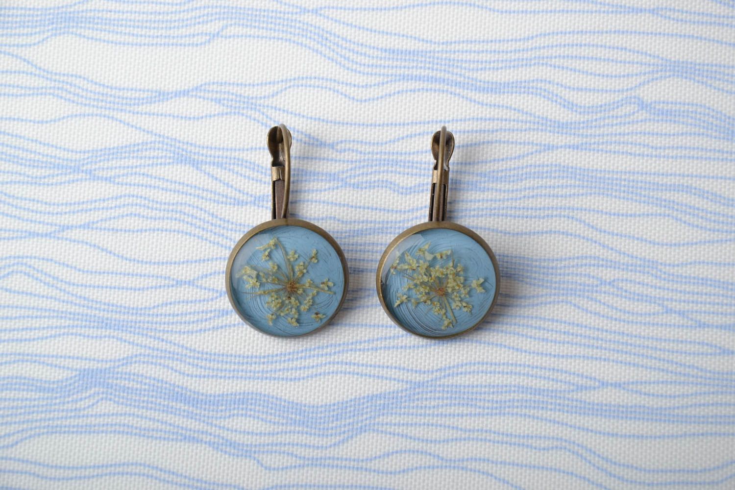 Blue earrings with natural flowers and epoxy resin photo 1
