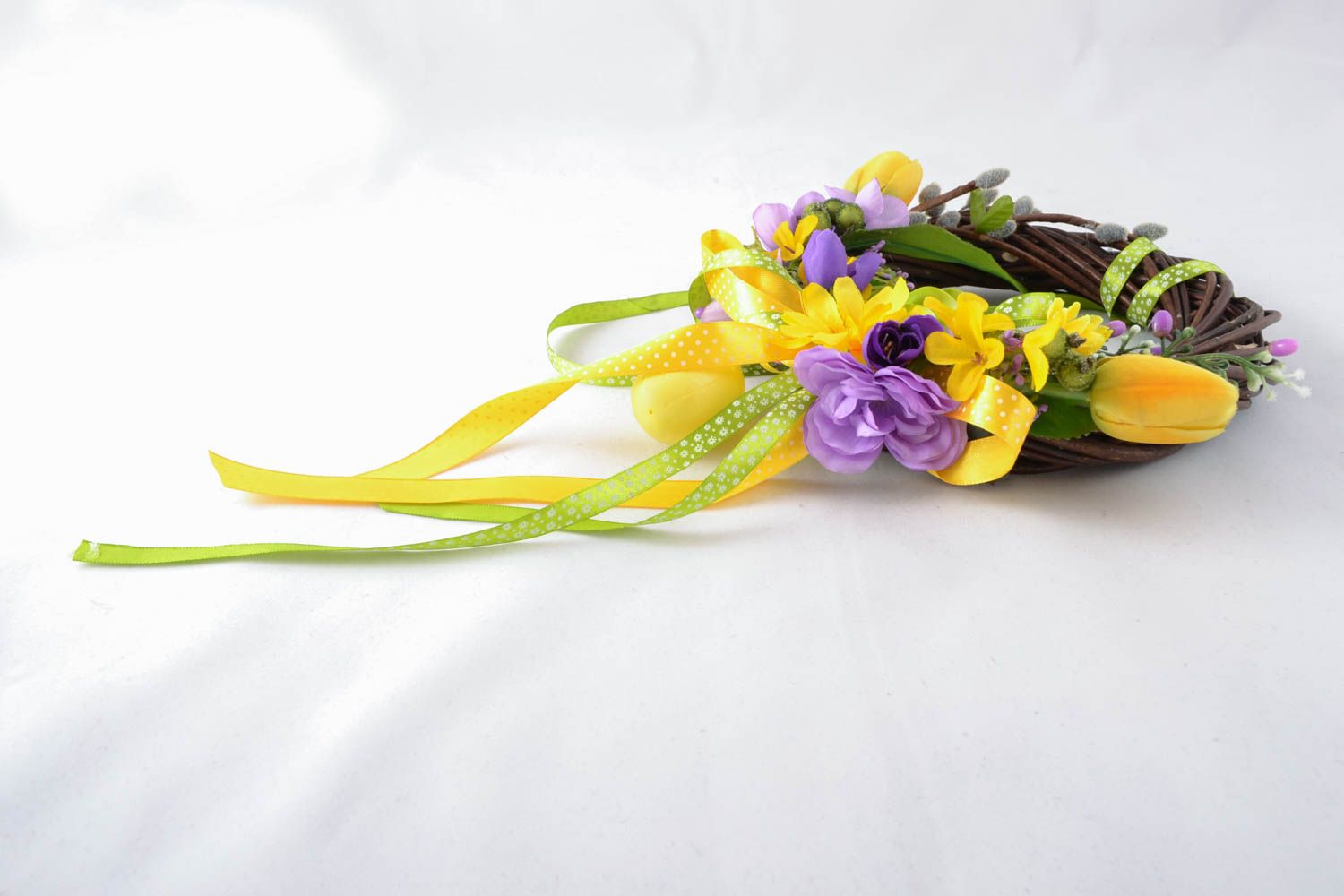 Easter willow wreath with artificial flowers photo 1