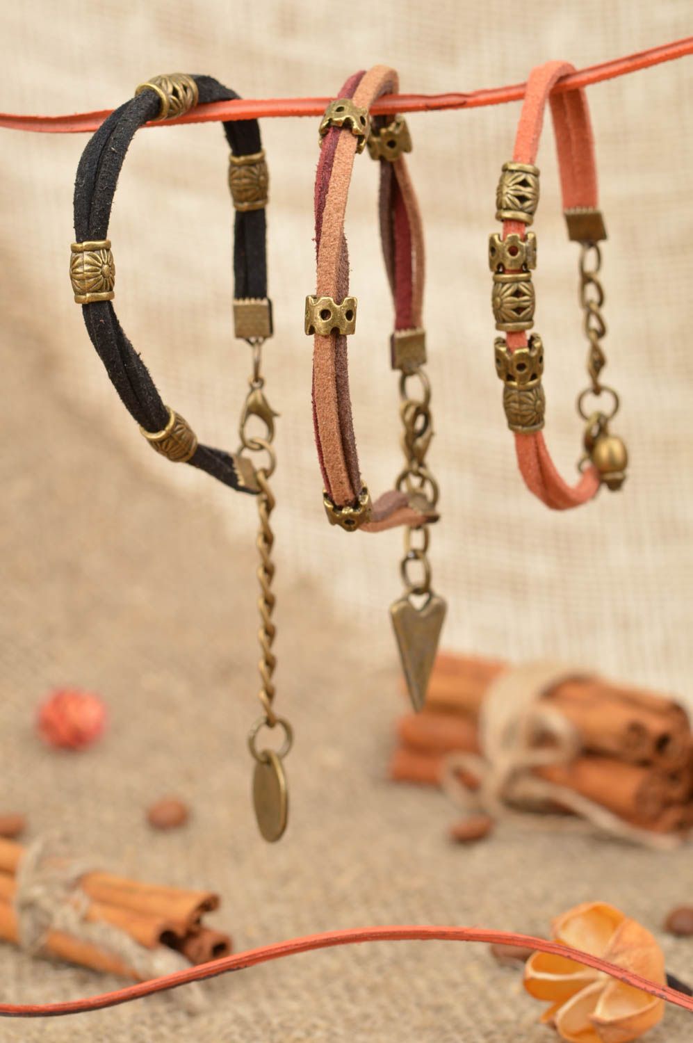 Set of 3 handmade designer woven suede cord bracelets with charms  photo 1