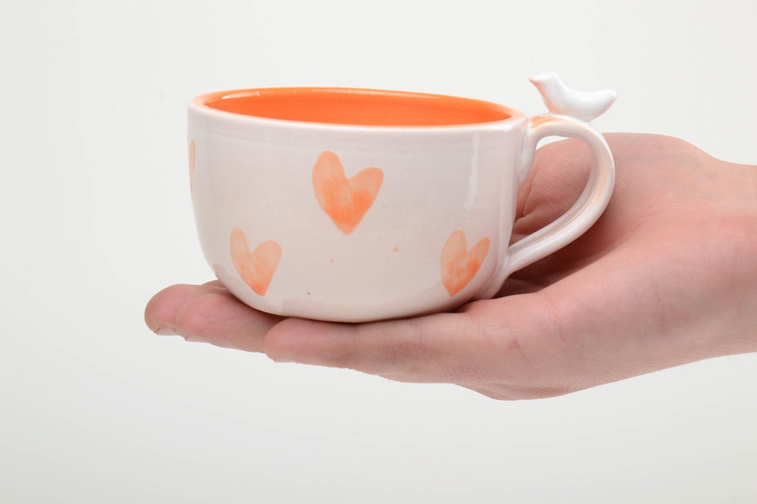 8 oz orange and white glazed ceramic teacup with a bird on handle and heart pattern photo 5