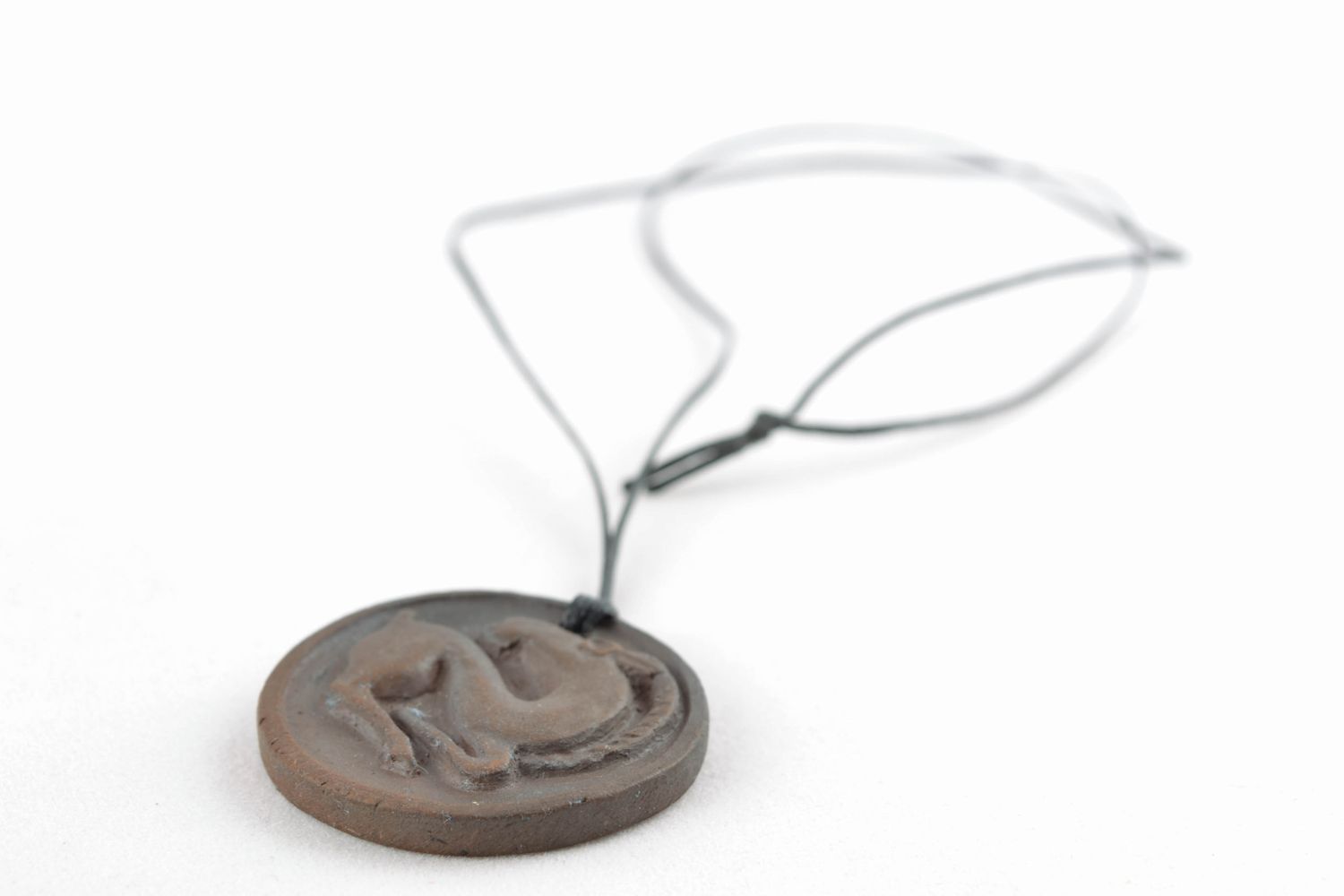 Round pendant made of black smoked ceramics photo 3