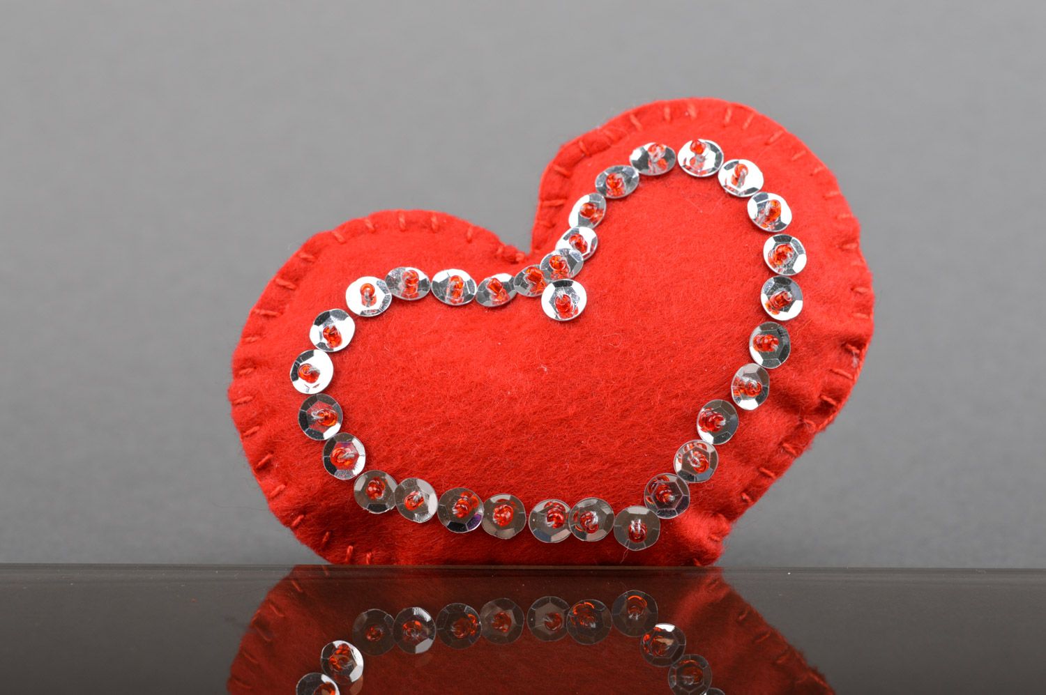 Handmade decorative red soft felt heart with paillettes for interior photo 1
