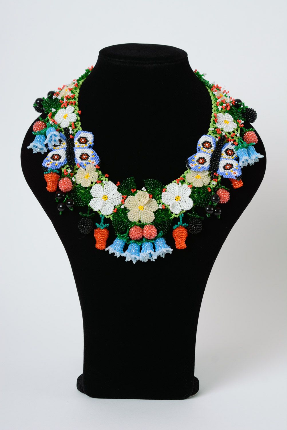 Massive colorful handmade necklace woven of beads with flowers and berries  photo 1