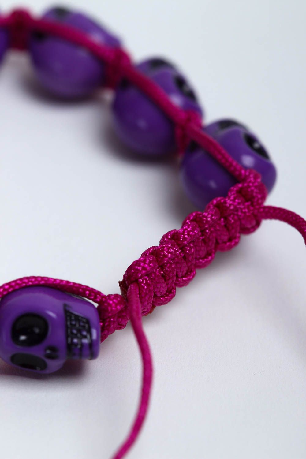 Purple strand skull beads bracelet on red cord for young girls photo 4