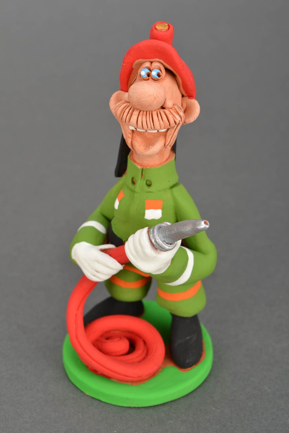 Ceramic figurine Firefighter with Fire-hose photo 3