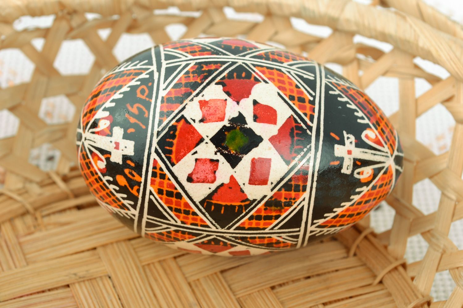 Homemade traditional colorful Easter egg painted with wax and aniline dyes photo 1