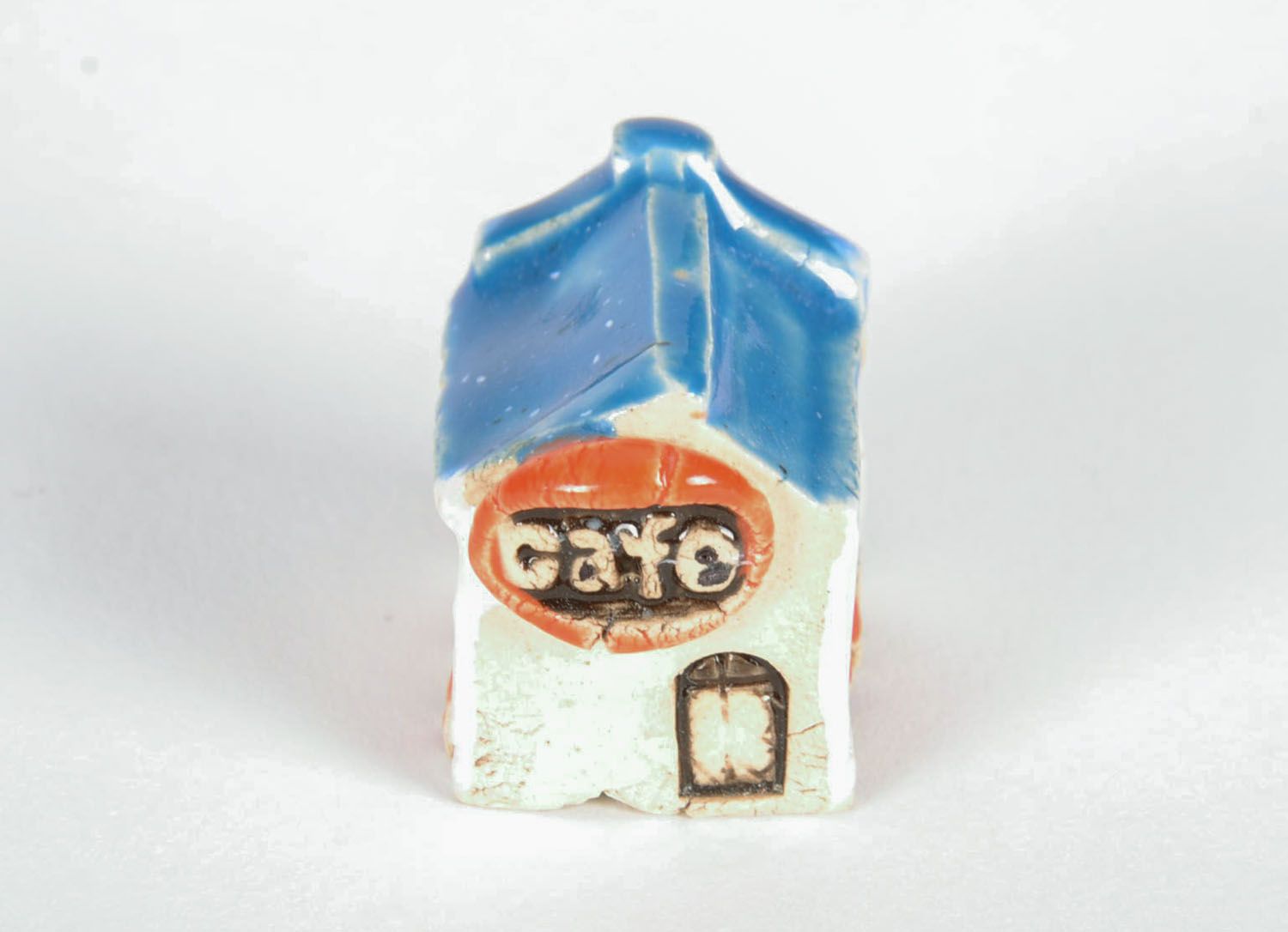 Figura de cerámica Café bajo tejado azul foto 5