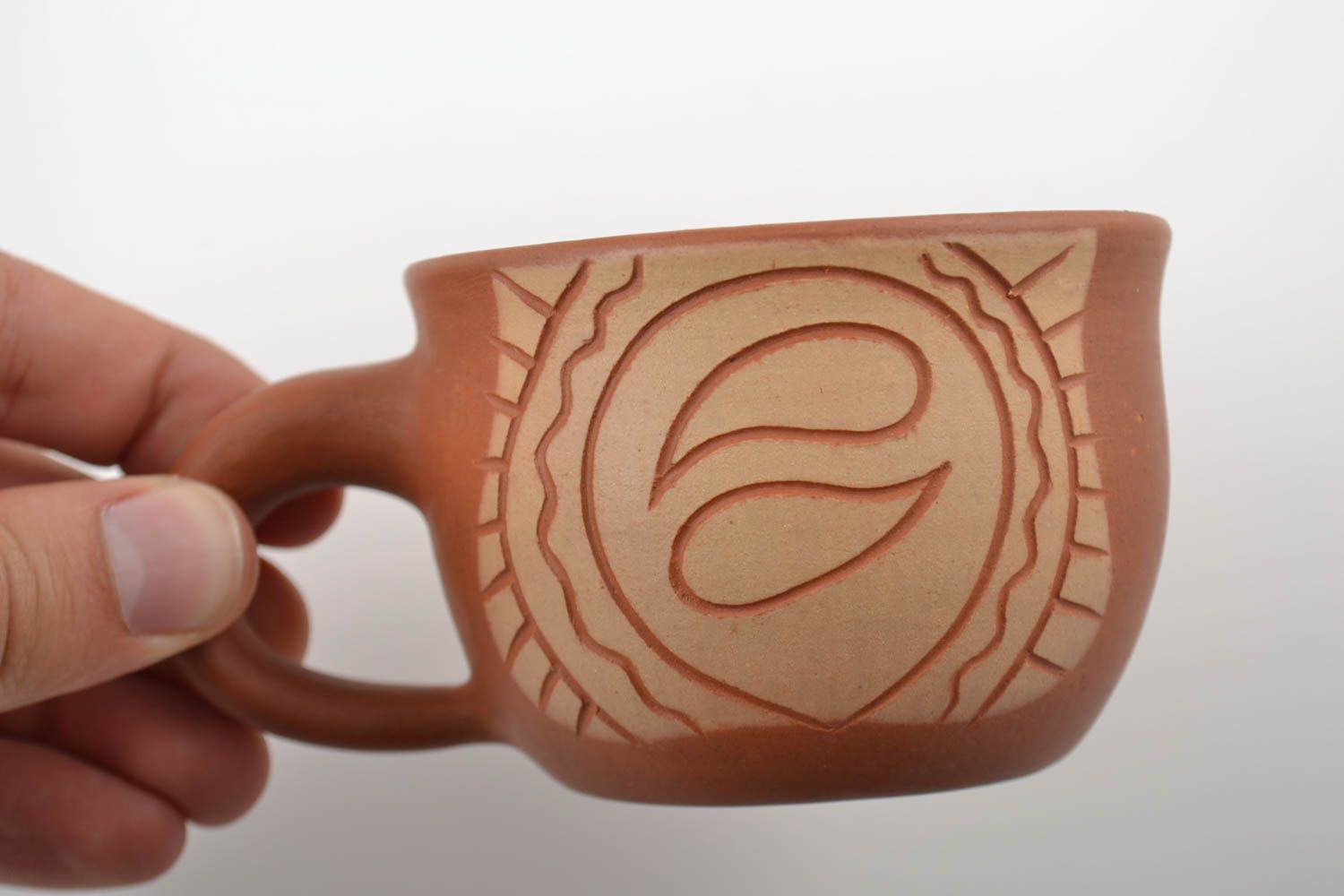 10 oz clay coffee cup with handle and cave drawings in beige and terracotta color photo 2