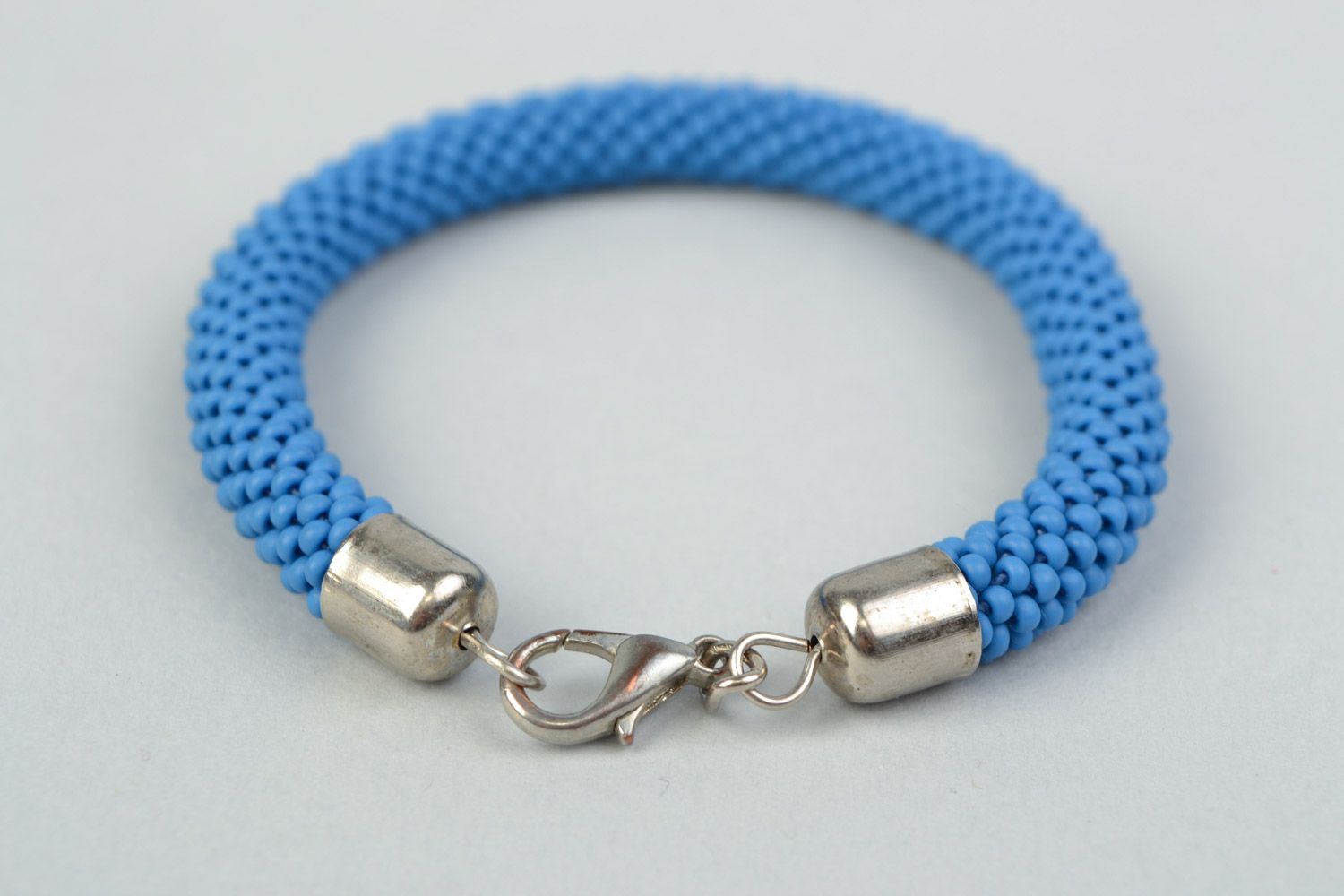 Handmade bright laconic beaded cord wrist bracelet of sky blue color for girl photo 4