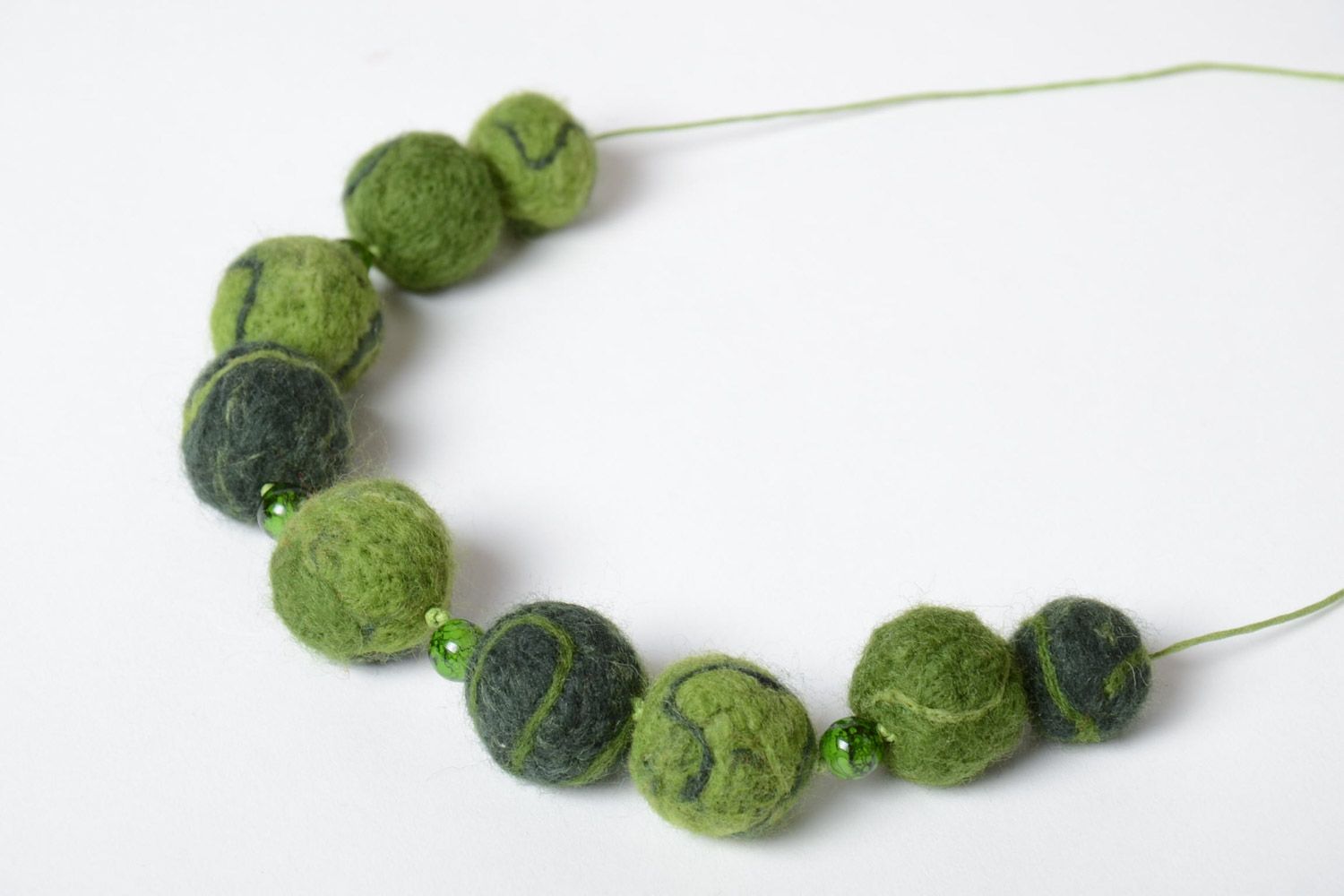 Handmade designer large beaded necklace made of wool using the technique of needle felting in green color photo 2