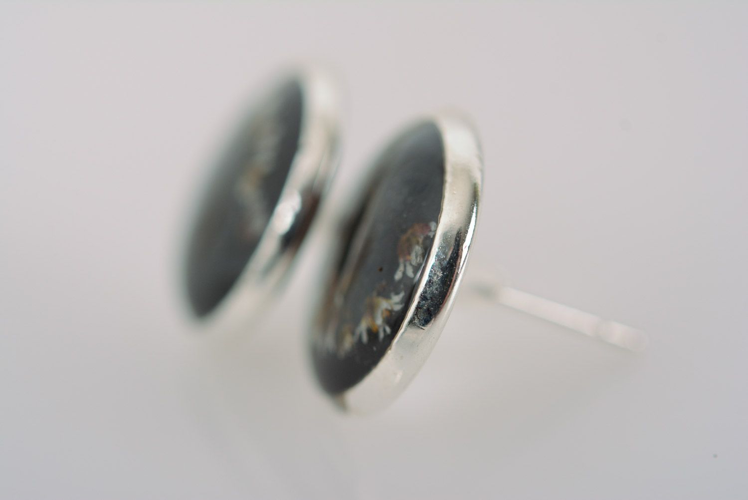 Homemade small black stud earrings with dried flower embedded in epoxy resin photo 3